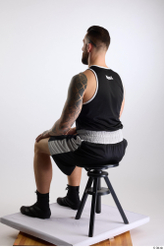 Whole Body Man White Sports Shorts Slim Athletic Sitting Top Studio photo references